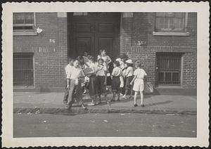 Group of children outside the North End Union, Parmenter Street, Boston