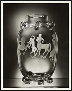 A glass vase with an original design by Paul Manship included in an exhibition of decorations in glass by twenty-seven world famous artists commissioned by Steuben Glass, Inc., entitled "Twenty-Seven Artists in Crystal".