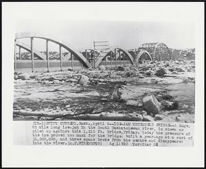 Ice-Jam Threatens Bridge--A huge, 82 miles long ice-jam in the South Saskatchewan river, is shown as piled up against this 1,215 ft. bridge, Friday. Today the pressure of the ice proved too much for the bridge, built a year-ago at a cost of $1,000,000, and three spans broke from the centre and disappeared into the river.