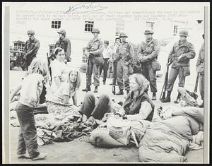 Welfare mothers, children and sympathizers who came to the capitol to protest cuts in welfare budget, roll out of their sleeping bags and blankets 10/2 after spending the night camped in front of national guardsmen.