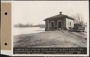 Contract No. 99, Enlargement of Fells High Level Distribution Reservoir, Stoneham, Malden, Melrose, looking east from by Access Road showing south and west sides of present gatehouse, enlargement of Fells Reservoir, Stoneham, Mass., Feb. 12, 1940