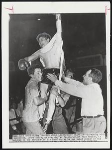 New World Lightweight Champion -- Screaming with happiness, Lauro Salas, an overstuffed featherweight from Mexico, is hoisted to the shoulders of his handlers as he was named winner