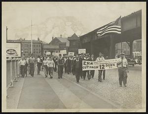 Banners flying, footsore, but hanging on, the remnant of Lynn's army of 200 protesting ERA workers on the last lap of their march to state ERA headquarters this afternoon. The "army" is shown leaving City square, Charlestown, on their way across the bridge to Boston.
