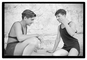 Two unidentified young men playing rock scissor paper