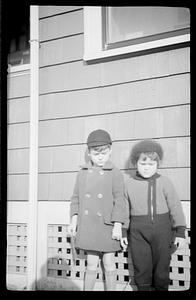 Two children posing outside