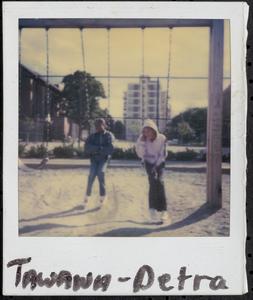 Tawana and Petra sitting on swings