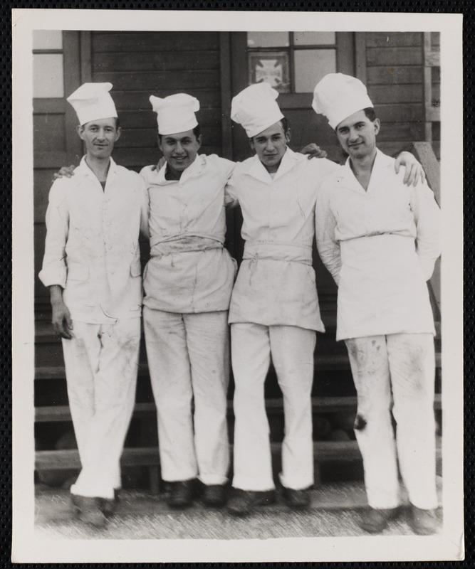 Four chefs posing together (names on back) - Digital Commonwealth