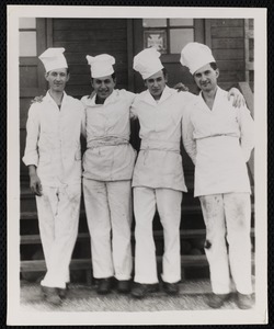 Four chefs posing together (names on back)