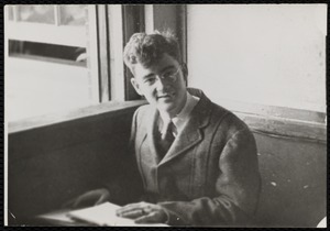 Portrait of young man at desk