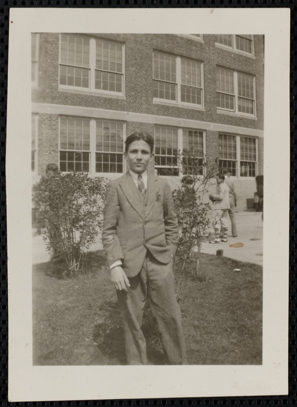 Male student in suit, in front of WHS, no i.d.