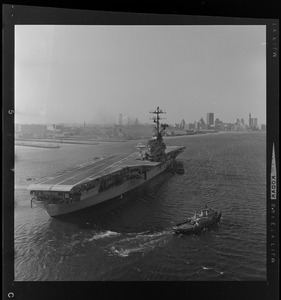 USS Wasp carrier with a landing strip nearing the Boston coastline
