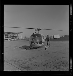 Man standing near helicopter