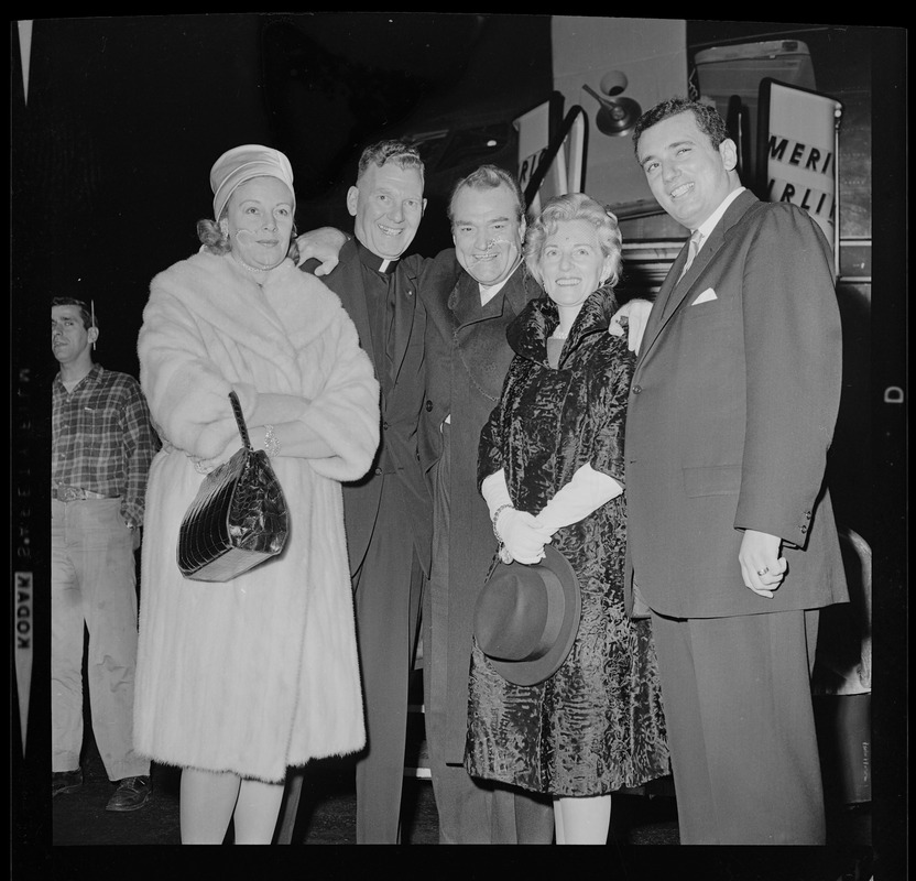 Red Skelton poses with his wife, Georgia Davis and three others after deplaning