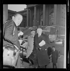 Men walking up stairs toward a photographer