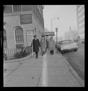 Members of Albert DeSalvo jury walking down the sidewalk near the Sheraton Commander Hotel entrance