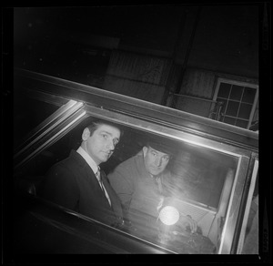 Albert DeSalvo and guard in the back seat of a car
