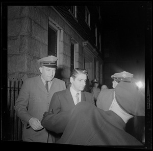 Two guards with DeSalvo outside the courthouse