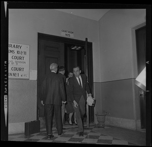 Men walking in and out of Court Room No. 5