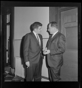 Assistant District Attorney Donald L. Conn, and criminal defense attorney, F. Lee Bailey, talking outside of a room