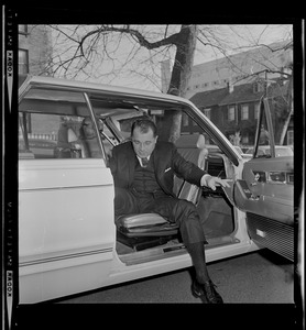 F. Lee Bailey, criminal defense attorney, exiting a car