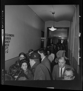 Crowd gathering in the hallway of courthouse