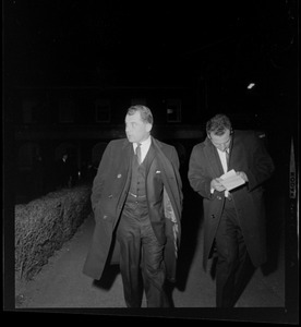 Criminal defense attorney F. Lee Bailey and another man walking through the parking lot