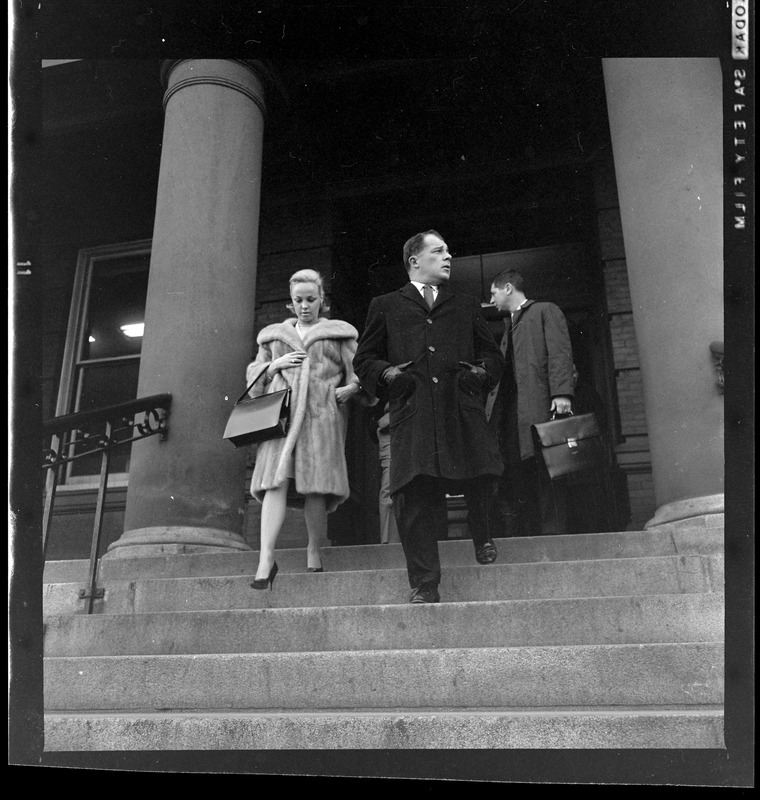 Criminal defense attorney F. Lee Bailey and his wife, Froma, walking down steps