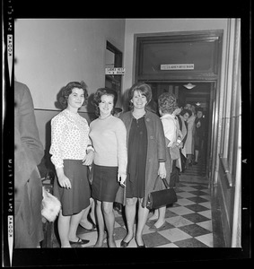 Group of women in a line outside of the women's restroom of courthouse
