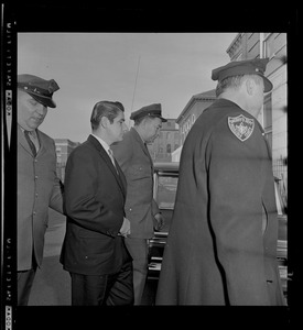 Albert DeSalvo with officers walking towards the courthouse
