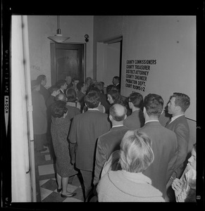 People gathered in courthouse hallway