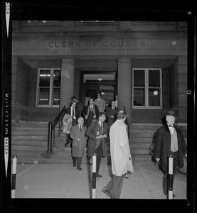Group of people walking out of the courthouse