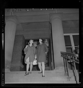 Two women walking down the courthouse stairs