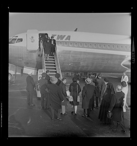 Jimmy Durante walking down the TWA airplane steps