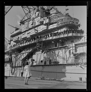 View of a woman waving to the crew aboard the USS Wasp carrier