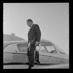 Attorney F. Lee Bailey standing by his plane