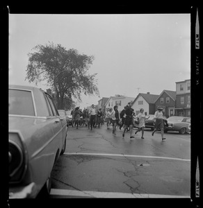 Eastie High boycotts classes - students from East Boston High School run rampant through traffic as they enjoyed a walkout much to the discomfort of parents and police