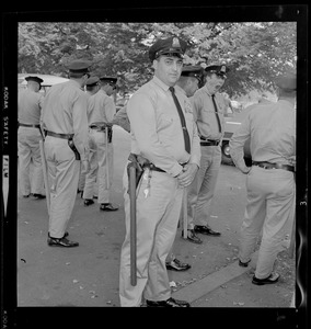 Group of officers standing near a street