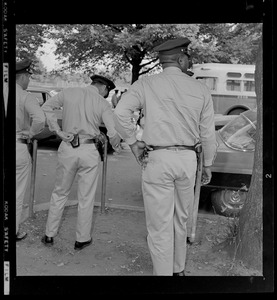 Officers standing together by a street