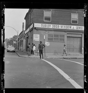 Officer outside of Dudley Door Window