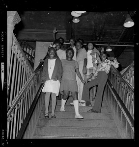 Group of young people posing on stairs