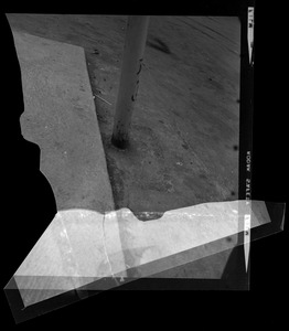 Photo of the ground and bottom of a pole