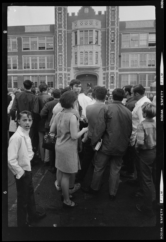 Parents talking to students outside East Boston School