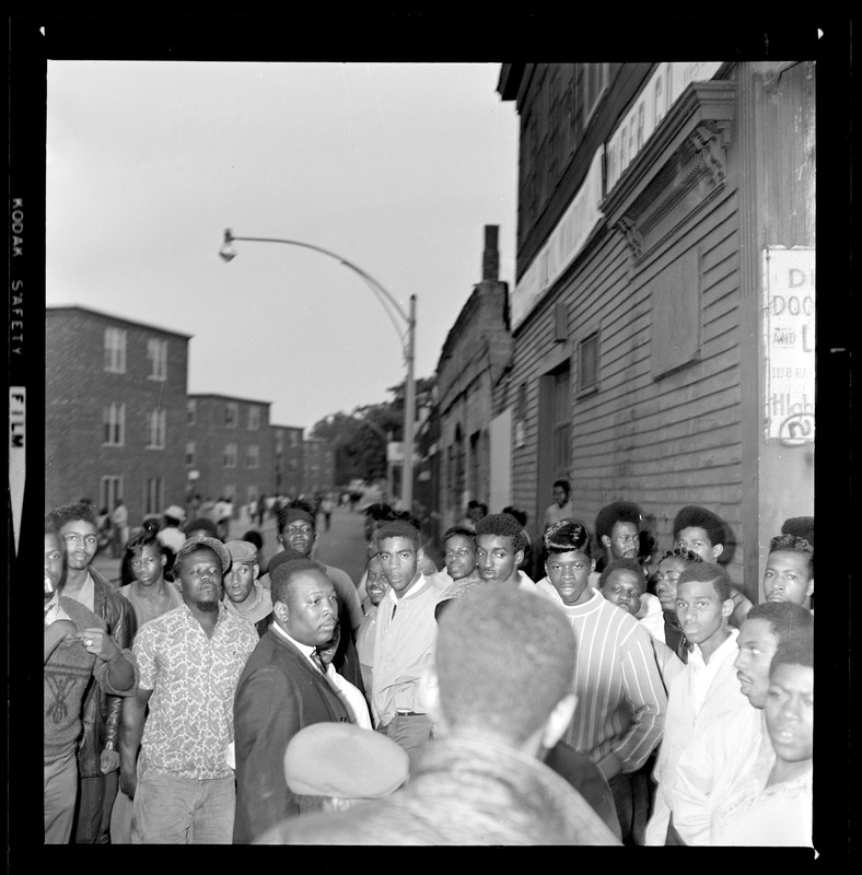 Group of people listening to a man - Digital Commonwealth