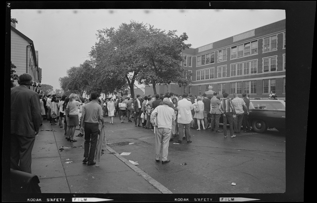 Crowds looking back at East Boston School