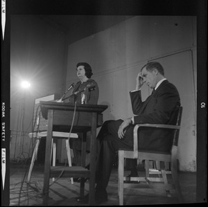 Louise Day Hicks addresses the room during the debate as Kevin White looks on