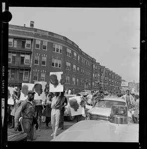 Demonstrators in the street with posters
