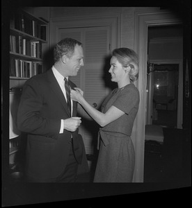 Mayor-Elect Kevin White's wife, Kathryn, fixes his tie before heading out