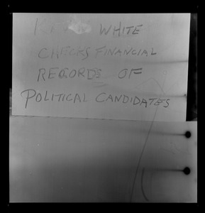 Photo of paper with "Kevin White checks financial records of political candidates" note
