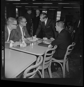 Governor John A. Volpe talks to a table of men