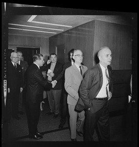 Governor John A. Volpe with other men standing in line